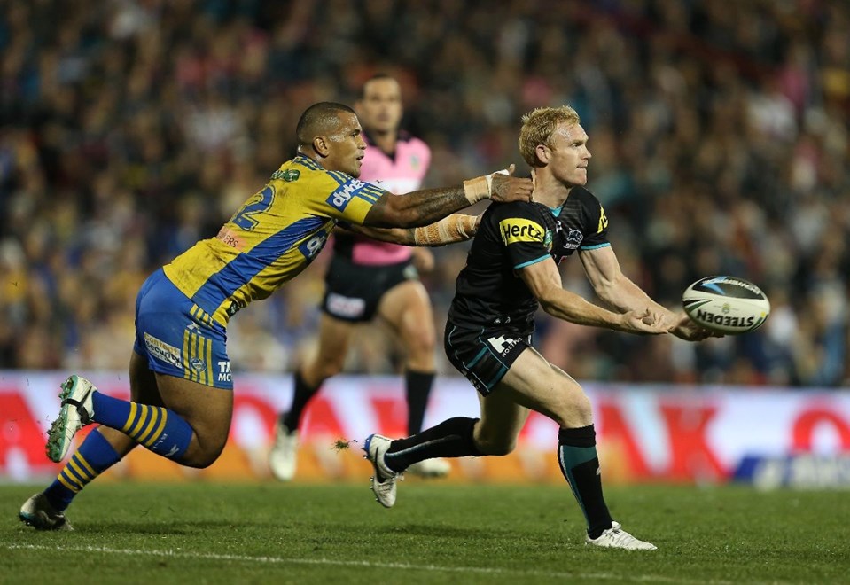 Digital Image by Robb Cox Â©nrlphotos.com : Peter Wallace is chased by Manu Mau : NRL Rugby League, Penrith Panthers V Parramatta Eels  at Sporting Bet Stadium, Penrith. Friday the 30th of May 2014.