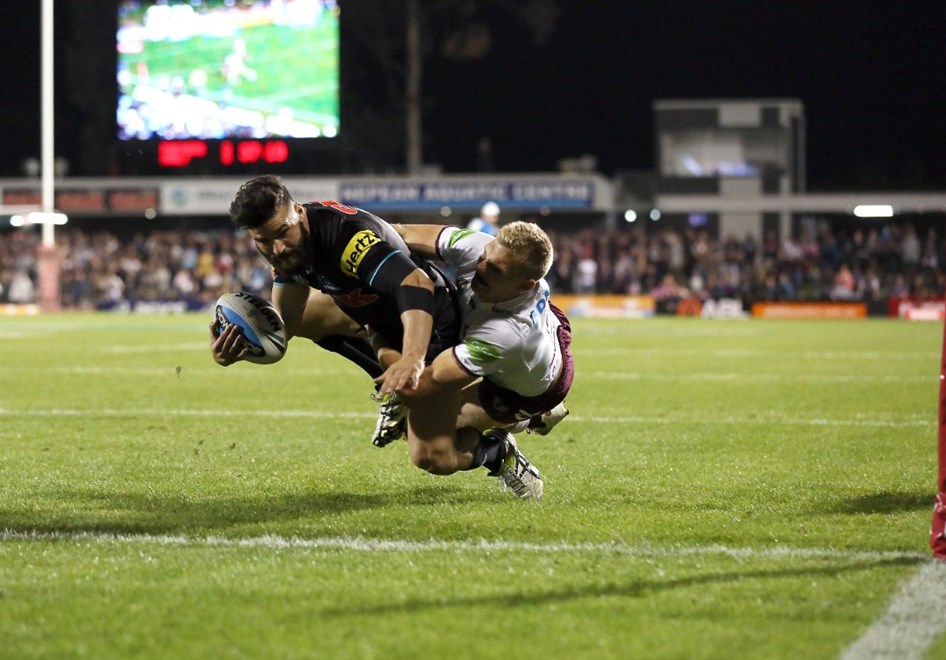 Josh Mansour carries Tom Trbojevic across the line for a try : Digital Image by Robb Cox Â©nrlphotos.com: :NRL Rugby League - Pantehrs V Sea Eagles at Pepper Stadium, Penrith. Saturday April 11th 2015.