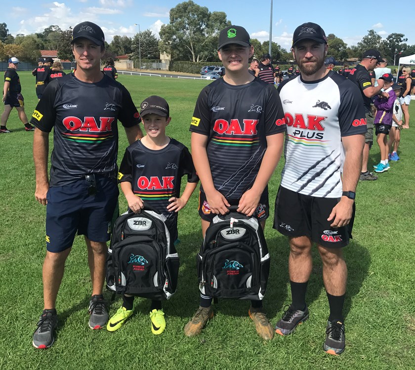 Daniel Kennedy and Rory Quarmby receive their Panthers backpacks after the clinic.