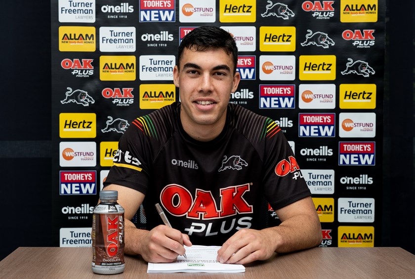 Charlie Staines signs his Panthers contract extension.